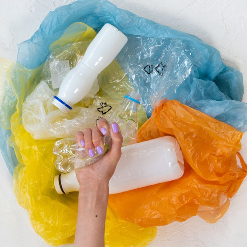 a woman putting plastic together