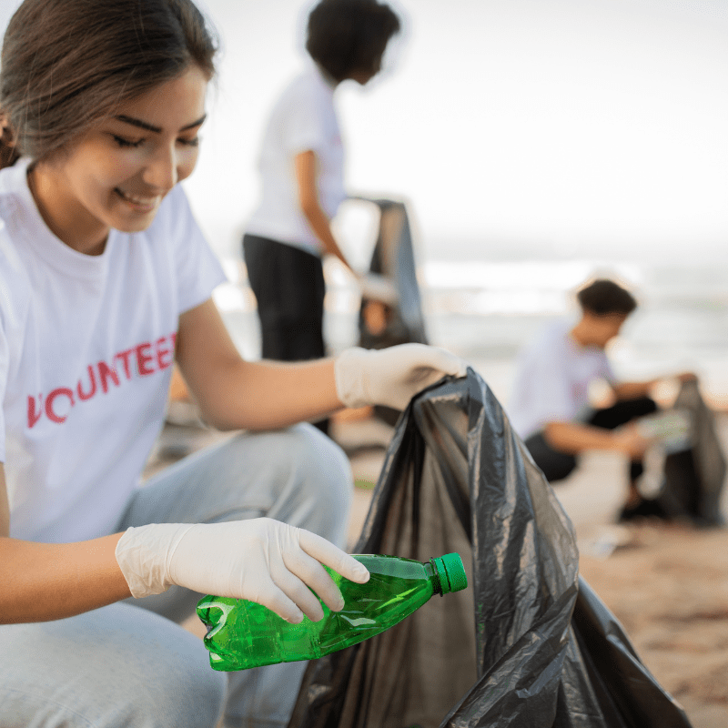 young volunteers picking up trash