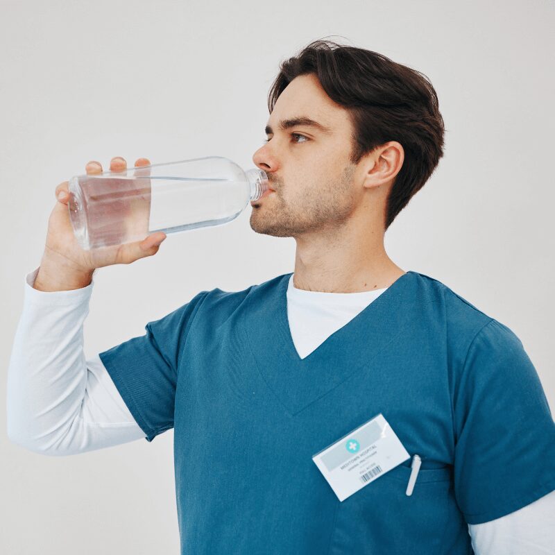 nurse drinking water for health while at work